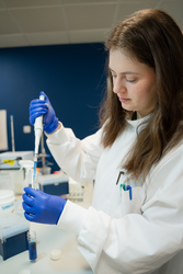 A researcher in the Department of Biology at York working in a laboratory